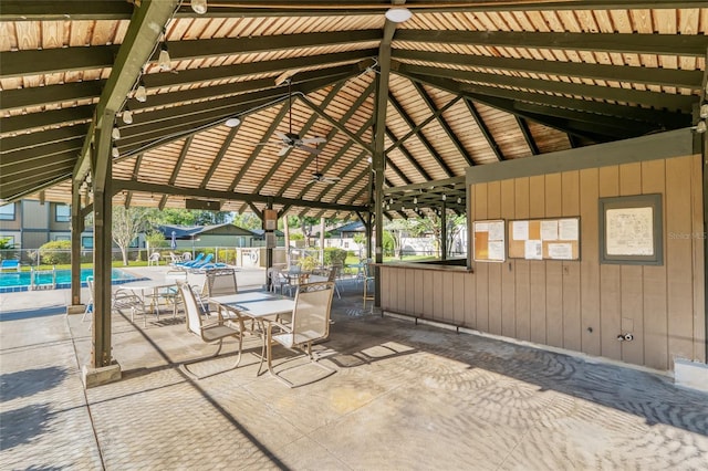 3815 NE 17th Street Cir, Ocala, FL 34470 - view of patio / terrace with a community pool and fence