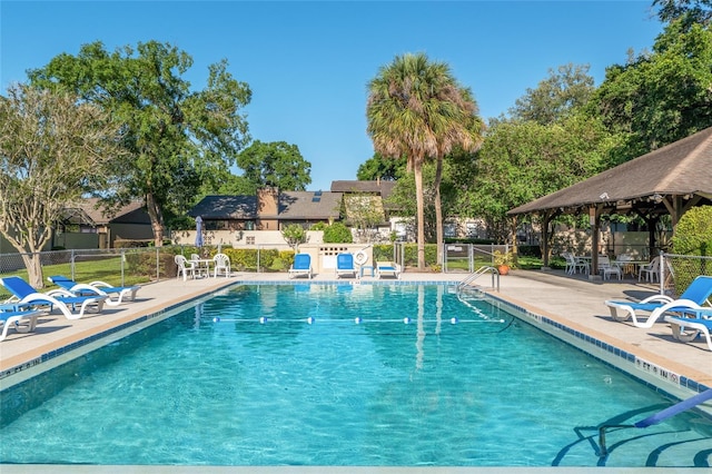 3815 NE 17th Street Cir, Ocala, FL 34470 - community pool featuring a gazebo, fence, and a patio area