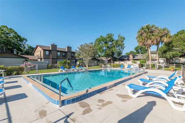 3815 NE 17th Street Cir, Ocala, FL 34470 - community pool featuring fence, a patio, and a residential view