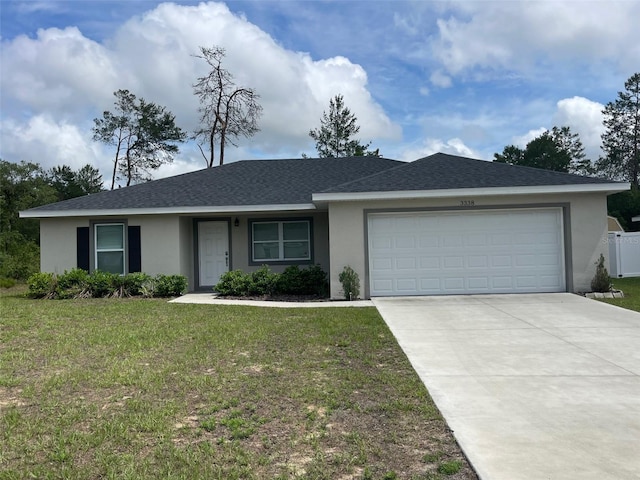 ranch-style house featuring stucco siding, an attached garage, and a front lawn