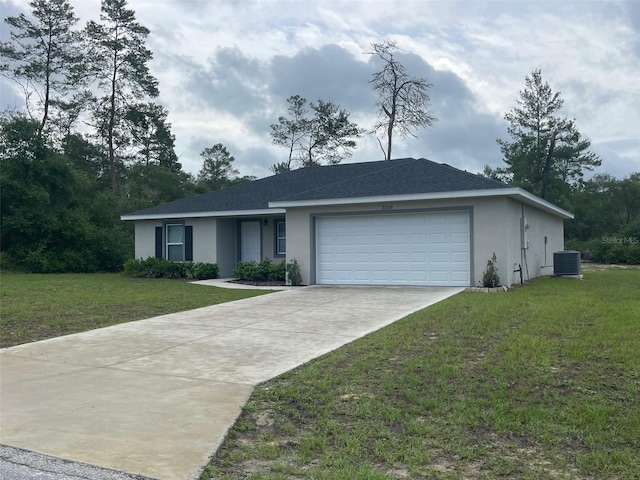 ranch-style home with stucco siding, cooling unit, an attached garage, and a front yard