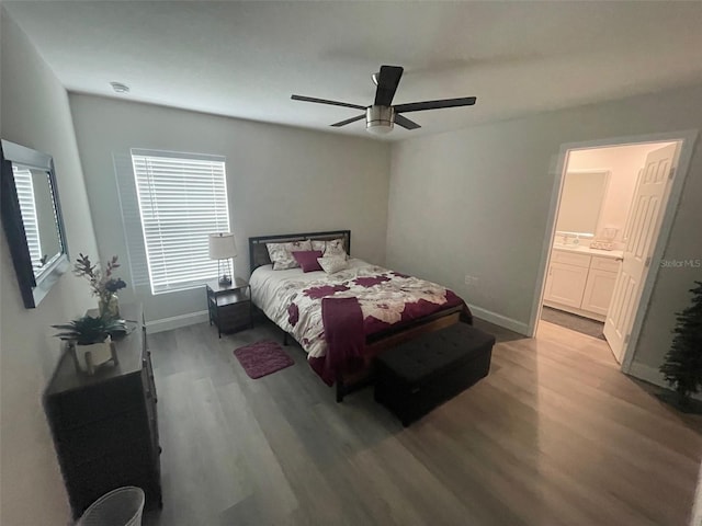 bedroom featuring wood finished floors, baseboards, and a ceiling fan