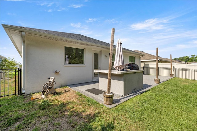 6557 SE 4th Ln, Ocala, FL 34472 - rear view of property featuring a patio and stucco siding