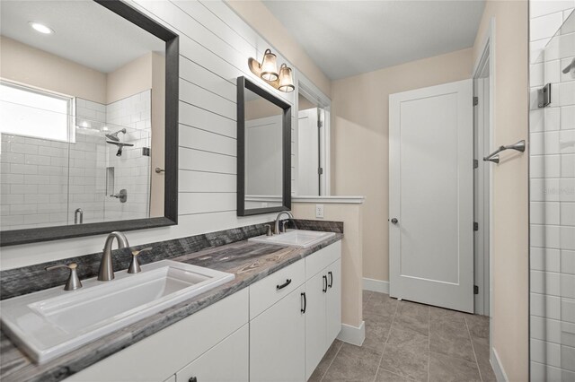 6557 SE 4th Ln, Ocala, FL 34472 - full bathroom featuring a shower stall, baseboards, double vanity, and tile patterned floors