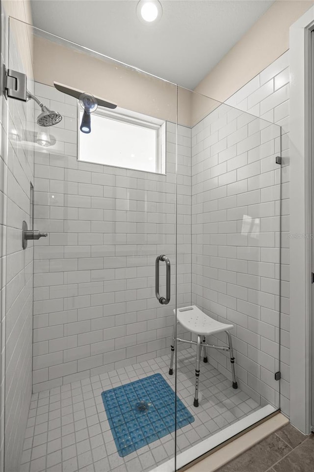6557 SE 4th Ln, Ocala, FL 34472 - bathroom featuring a shower stall and tile patterned floors