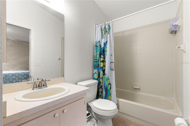 bathroom with toilet, shower / bath combo, vanity, a textured wall, and tile patterned floors