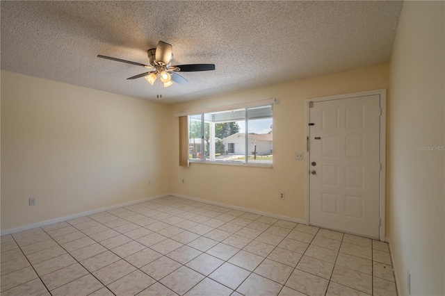 8463 SW 108th Pl, Ocala, FL 34481 - spare room with ceiling fan, a textured ceiling, and light tile patterned floors