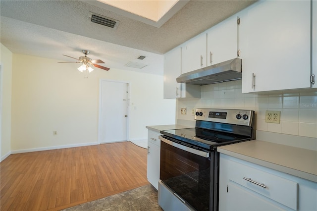 8463 SW 108th Pl, Ocala, FL 34481 - kitchen with stainless steel range with electric stovetop, under cabinet range hood, light countertops, tasteful backsplash, and ceiling fan