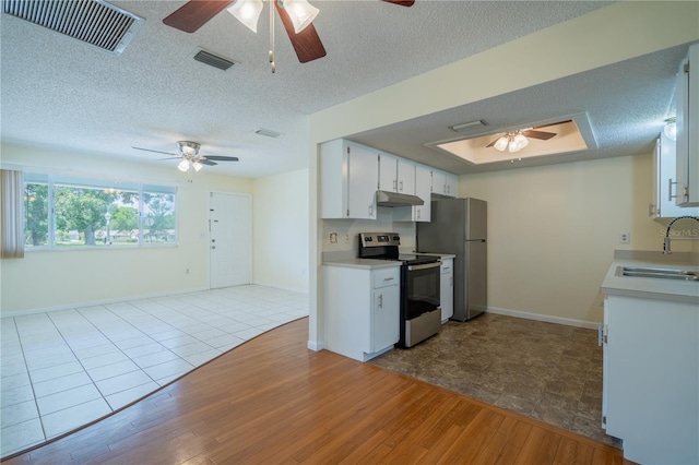 8463 SW 108th Pl, Ocala, FL 34481 - kitchen featuring stainless steel appliances, ceiling fan, under cabinet range hood, and a textured ceiling