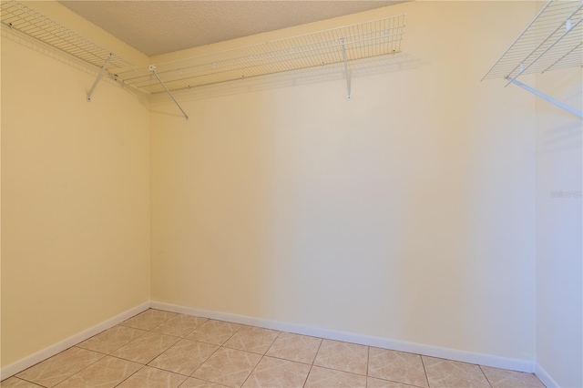 8463 SW 108th Pl, Ocala, FL 34481 - spacious closet featuring light tile patterned floors
