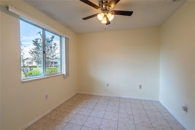 8463 SW 108th Pl, Ocala, FL 34481 - empty room featuring ceiling fan, light tile patterned floors, and a textured ceiling