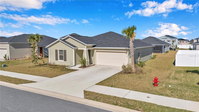 view of front of house with an attached garage, board and batten siding, concrete driveway, and a residential view
