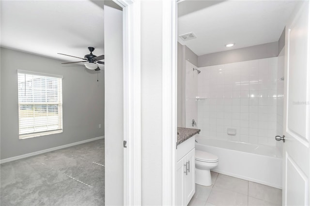 full bathroom with a ceiling fan, vanity, toilet, bathtub / shower combination, and tile patterned floors