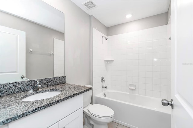 bathroom with toilet, washtub / shower combination, vanity, and tile patterned floors