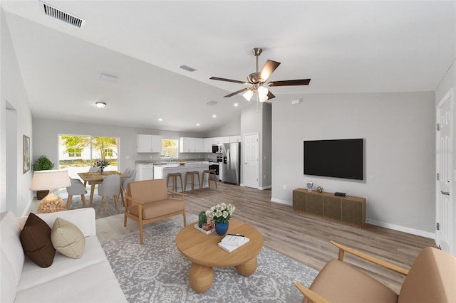 25 Juniper Pass Way, Ocala, FL 34480 - living area featuring vaulted ceiling, light wood-type flooring, baseboards, a ceiling fan, and recessed lighting