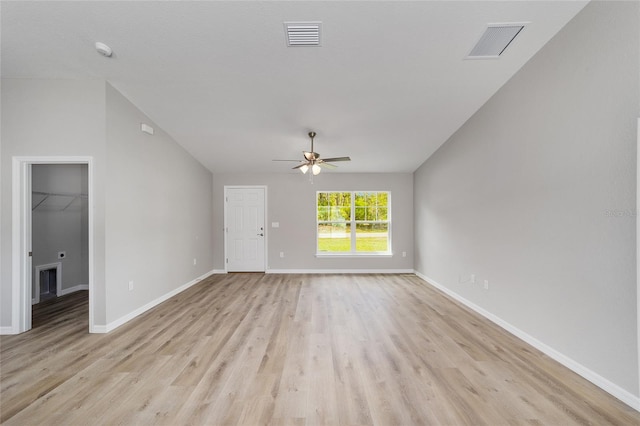 25 Juniper Pass Way, Ocala, FL 34480 - unfurnished living room featuring light wood-style floors, ceiling fan, vaulted ceiling, and baseboards