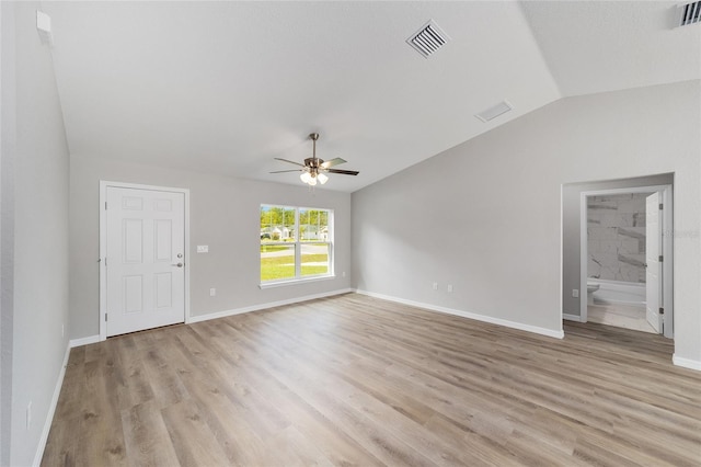 25 Juniper Pass Way, Ocala, FL 34480 - unfurnished living room featuring lofted ceiling, ceiling fan, light wood-type flooring, and baseboards