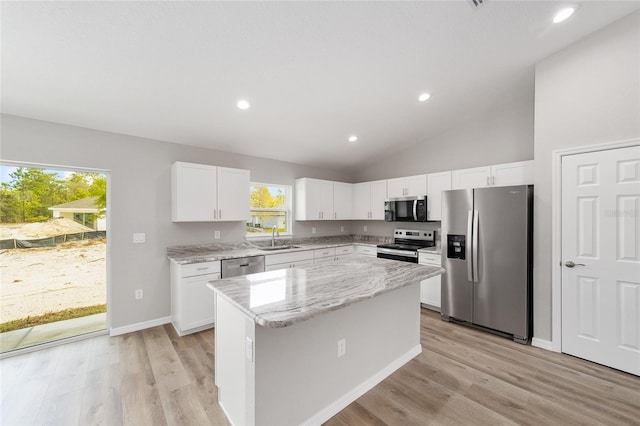 25 Juniper Pass Way, Ocala, FL 34480 - kitchen with appliances with stainless steel finishes, a sink, light wood-style flooring, a center island, and recessed lighting