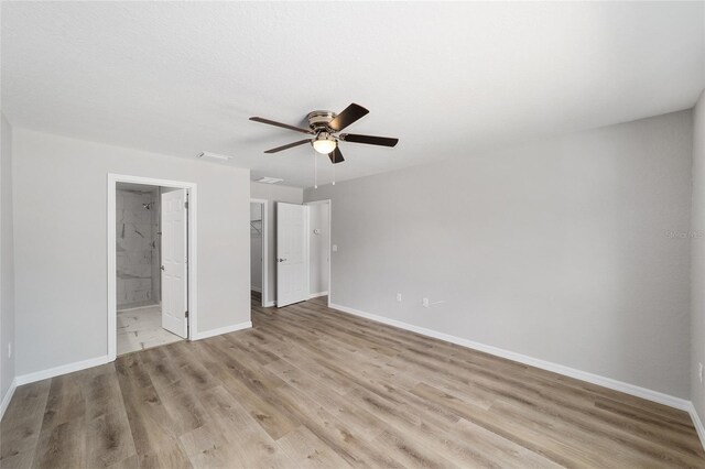 25 Juniper Pass Way, Ocala, FL 34480 - unfurnished bedroom with light wood-style flooring, baseboards, and a closet