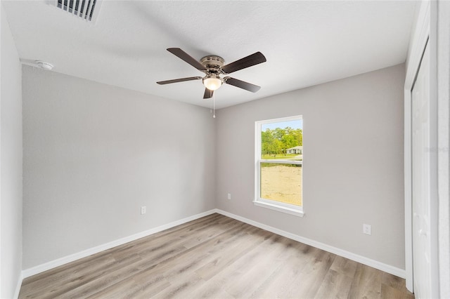 25 Juniper Pass Way, Ocala, FL 34480 - empty room featuring light wood-style flooring, a ceiling fan, and baseboards