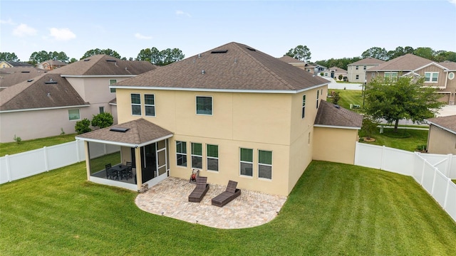 5653 SW 50th Ter, Ocala, FL 34474 - rear view of property with a sunroom, roof with shingles, stucco siding, a patio, and a residential view