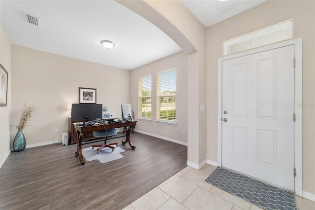 5653 SW 50th Ter, Ocala, FL 34474 - home office featuring arched walkways, baseboards, and light wood-style flooring
