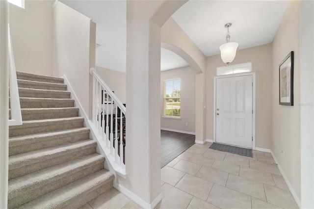 5653 SW 50th Ter, Ocala, FL 34474 - entryway with arched walkways, stairway, and baseboards