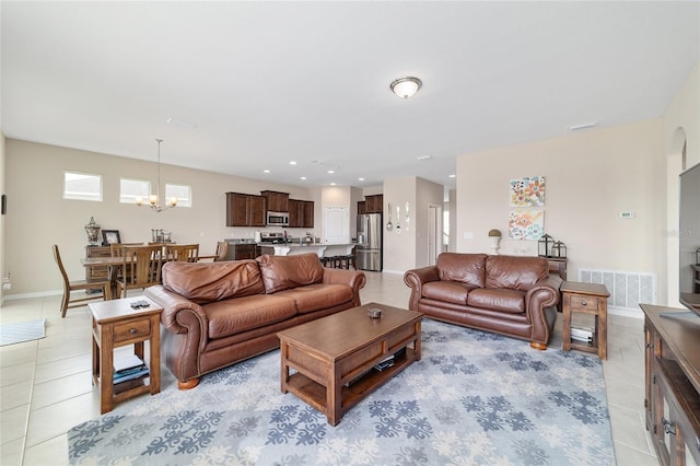5653 SW 50th Ter, Ocala, FL 34474 - living room featuring a chandelier, light tile patterned floors, baseboards, and recessed lighting