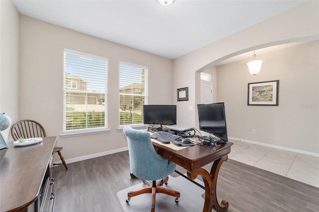 5653 SW 50th Ter, Ocala, FL 34474 - office with arched walkways, wood finished floors, and baseboards