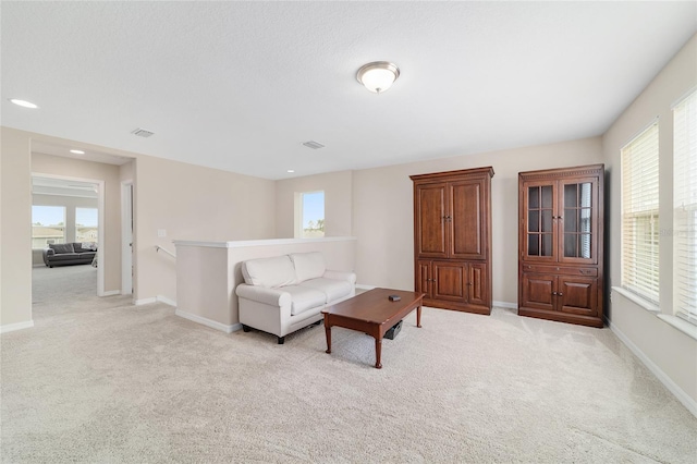5653 SW 50th Ter, Ocala, FL 34474 - carpeted living room with baseboards and recessed lighting