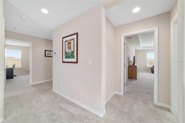 5653 SW 50th Ter, Ocala, FL 34474 - hallway with light carpet, healthy amount of natural light, attic access, and baseboards