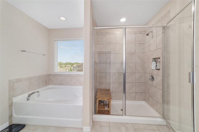 5653 SW 50th Ter, Ocala, FL 34474 - bathroom with tile patterned flooring, a stall shower, a bath, and recessed lighting