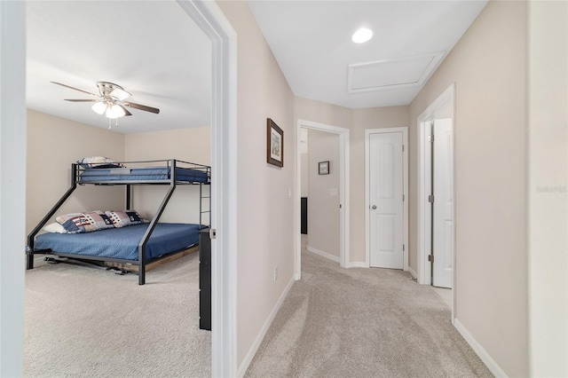 5653 SW 50th Ter, Ocala, FL 34474 - hall featuring carpet floors, baseboards, and attic access