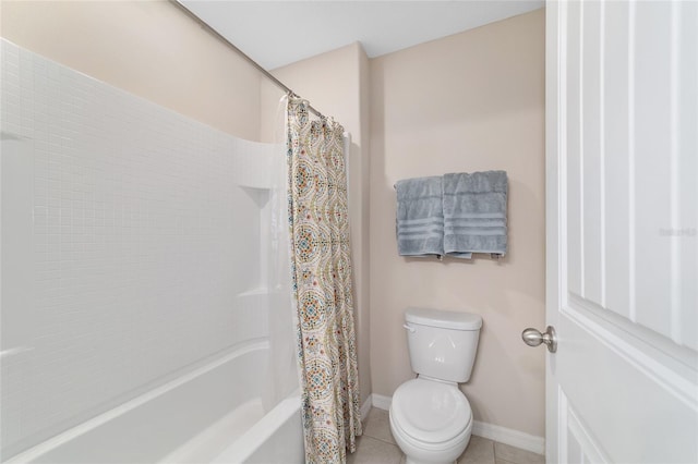 5653 SW 50th Ter, Ocala, FL 34474 - full bathroom with tile patterned flooring, toilet, baseboards, and shower / bath combo with shower curtain