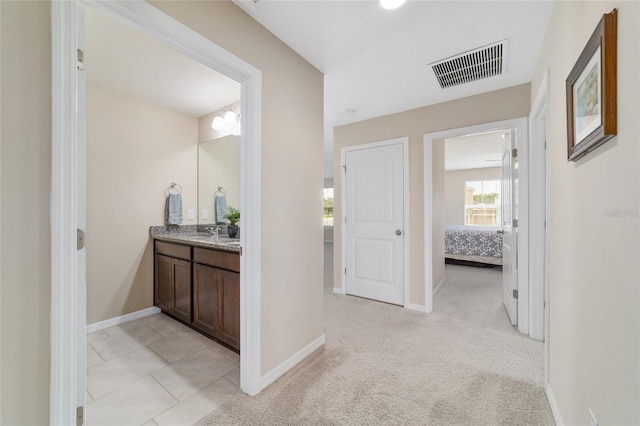 5653 SW 50th Ter, Ocala, FL 34474 - ensuite bathroom featuring baseboards and vanity