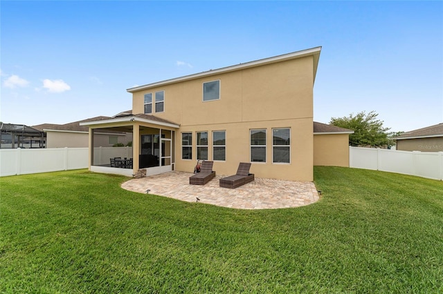 5653 SW 50th Ter, Ocala, FL 34474 - back of property with stucco siding, a patio, a sunroom, and roof with shingles