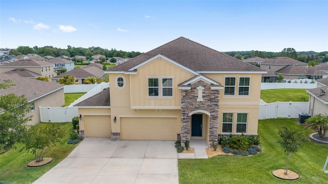 5653 SW 50th Ter, Ocala, FL 34474 - traditional home featuring roof with shingles, stone siding, driveway, central air condition unit, and stucco siding
