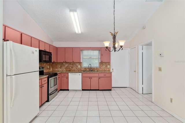 kitchen featuring white appliances, a sink, backsplash, a chandelier, and lofted ceiling