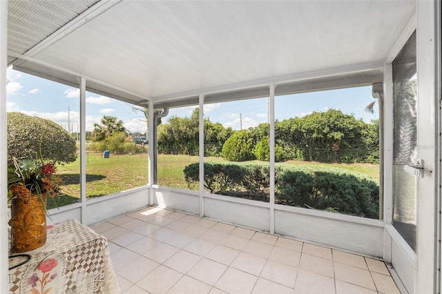 unfurnished sunroom with healthy amount of natural light