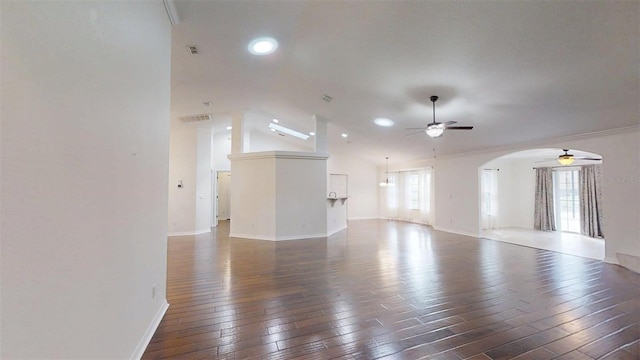 10528 SW 27th Ave, Ocala, FL 34476 - unfurnished living room featuring a ceiling fan, arched walkways, wood-type flooring, vaulted ceiling, and baseboards