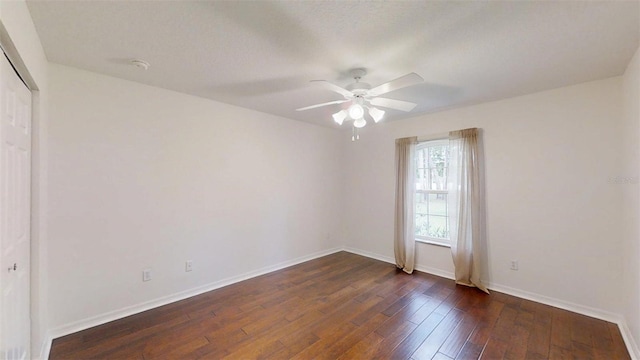 10528 SW 27th Ave, Ocala, FL 34476 - empty room with a ceiling fan, baseboards, and dark wood-type flooring