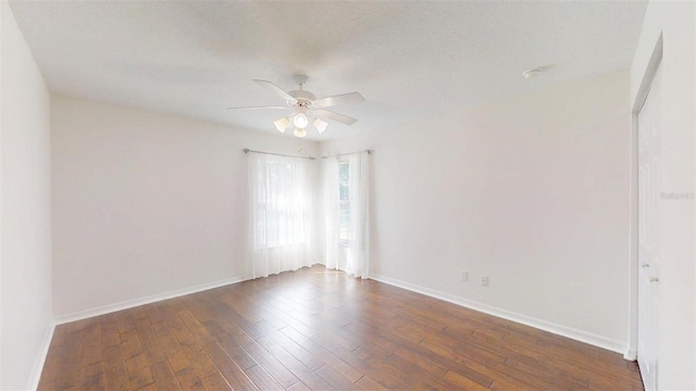 10528 SW 27th Ave, Ocala, FL 34476 - empty room with a ceiling fan, hardwood / wood-style floors, and baseboards