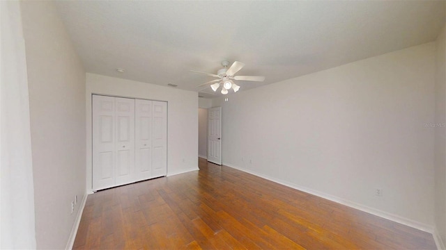 10528 SW 27th Ave, Ocala, FL 34476 - unfurnished bedroom with wood-type flooring, baseboards, a closet, and ceiling fan