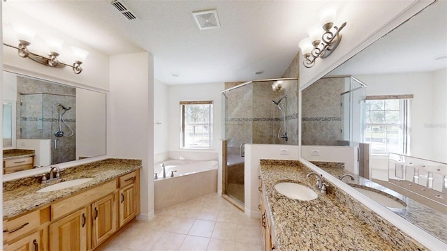 10528 SW 27th Ave, Ocala, FL 34476 - bathroom with a shower stall, a bath, and two vanities