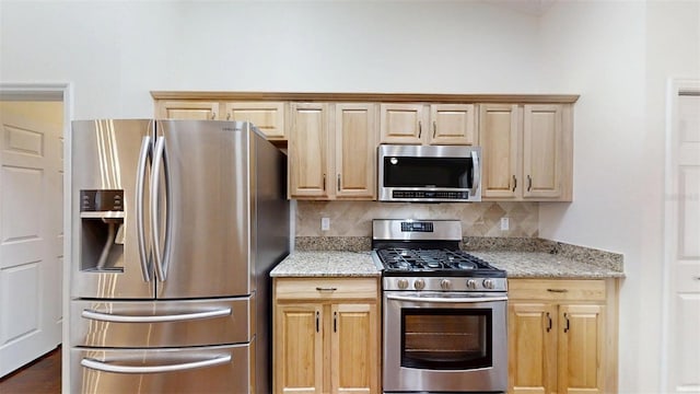 10528 SW 27th Ave, Ocala, FL 34476 - kitchen with appliances with stainless steel finishes, backsplash, light stone countertops, and light brown cabinetry