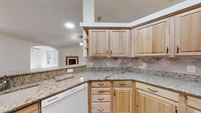 10528 SW 27th Ave, Ocala, FL 34476 - kitchen with white dishwasher, ceiling fan, light brown cabinets, a sink, and tasteful backsplash