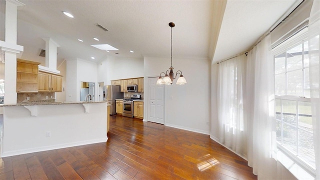 10528 SW 27th Ave, Ocala, FL 34476 - kitchen featuring stainless steel appliances, open shelves, a chandelier, a breakfast bar, and tasteful backsplash