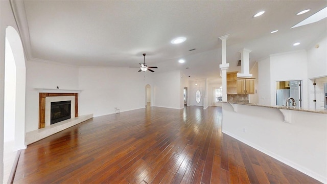 10528 SW 27th Ave, Ocala, FL 34476 - unfurnished living room featuring a fireplace, ceiling fan, dark wood-type flooring, baseboards, and recessed lighting