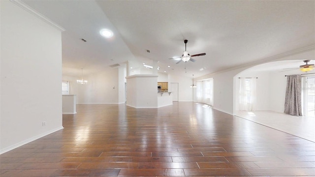 10528 SW 27th Ave, Ocala, FL 34476 - unfurnished living room featuring a ceiling fan, vaulted ceiling, hardwood / wood-style flooring, plenty of natural light, and crown molding