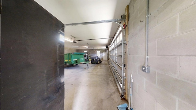 10528 SW 27th Ave, Ocala, FL 34476 - garage featuring a garage door opener and concrete block wall